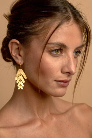 Model wearing Pinnate Earrings.
